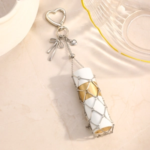 Elegant stainless steel heart mesh lipstick holder keychain with golden bow charm