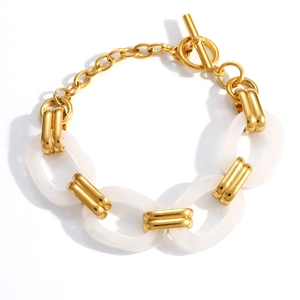 Minimalist gold stainless steel bracelet with white resin links and elegant OT toggle clasp