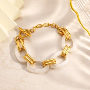 Elegant gold link bracelet with white marble resin rings and stylish toggle clasp closure