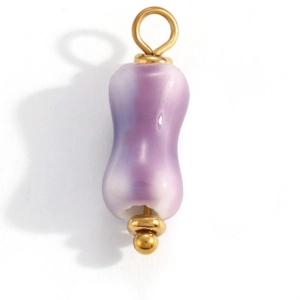 Detailed macro shot of a purple gradient peanut-shaped bead pendant with gold hardware