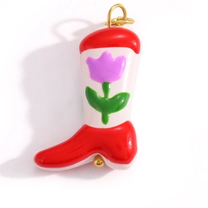 Detail of a red enamel cowboy boot pendant with a purple tulip pattern and gold ring