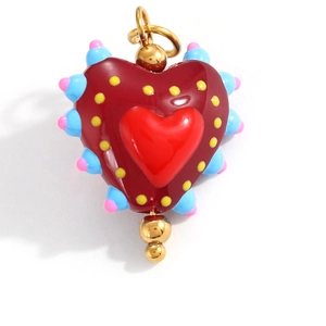 Detail of a colorful enamel heart pendant with pop art style and gold hardware
