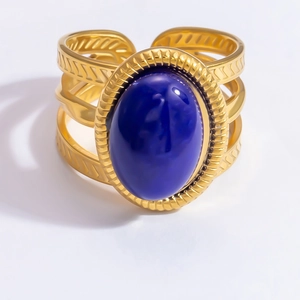 Detailed close-up of retro 18k gold plated open ring with deep blue oval gemstone inlay
