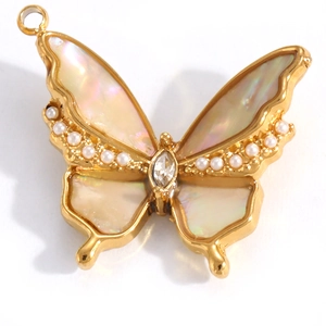 Detail showing gold butterfly pendant with shell inlay, pearls, and a zircon stone