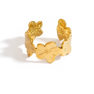 Adjustable golden stainless steel ring featuring minimalist carved flower patterns