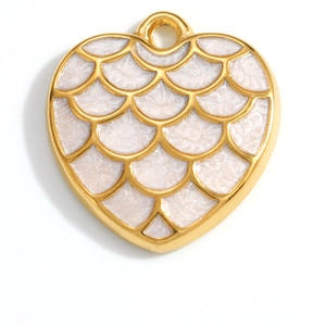 Detailed close-up of heart-shaped gold-plated pendant with white glitter enamel fish scales