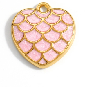 Detail view of heart pendant with pink scale texture and 18K gold plated metal edges