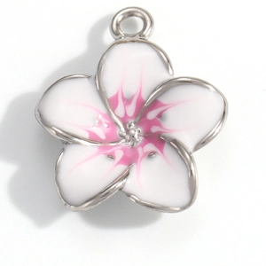 Detail of silver floral charm with white enamel petals and pink center gradient detail