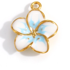 Macro shot of gold-plated five-petal flower pendant with white and blue enamel detail