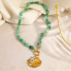 Bohemian ocean shell necklace with green natural stones and golden starfish pendant