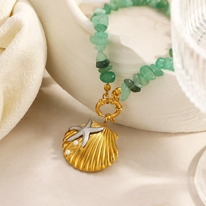 Bohemian seashell pendant necklace with green natural stones and golden starfish charms