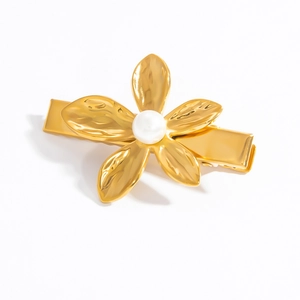 Vintage 18K gold plated flower hair clip with pearl center on white background
