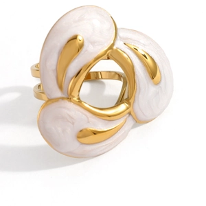 Macro detail of whale fin ring with white enamel inlay and 18k gold plating finish