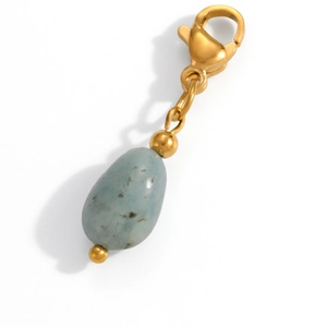 Detailed macro view of heart flower natural stone pendant with gold clasp and bead accents