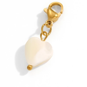 Detail view of a gold heart pendant with a white resin stone and lobster clasp for DIY jewelry