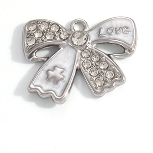 Detail of silver bow pendant with white enamel, crystal rhinestones and Love engraving