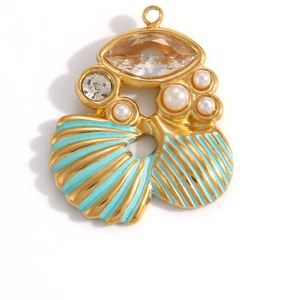 Elegant gold-plated ocean-themed shell pendant with amber stone and pearls on white backdrop