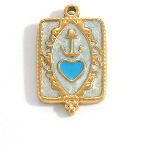 Macro detail of golden nautical pendant featuring blue heart and anchor with embossed frame