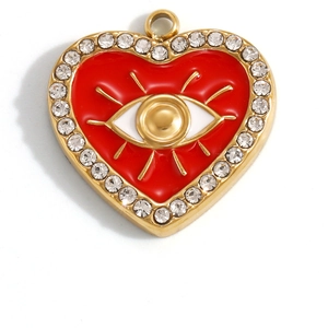 Macro detail of red enamel heart pendant with devil eye design and diamond accents