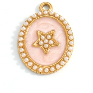 Detailed view of an oval gold pendant with pink enamel, star motif, and pearl borders