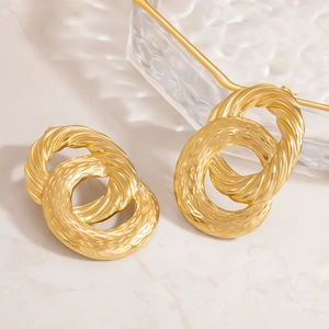 Textured 18K gold plated interlocking hoop earrings in a minimalist layered design