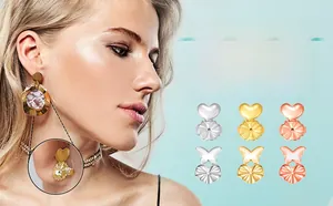 Macro detail of heart and butterfly earring lifters for heavy earrings in three colors