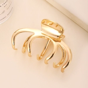Minimalist golden octopus metal hair claw clip with elegant metallic gloss finish