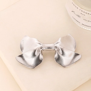 Elegant silver metal bow hair clip with brushed texture for women's hairstyle