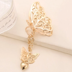 Pince à cheveux papillon dorée avec chaîne à pompons et pendentif coeur élégant