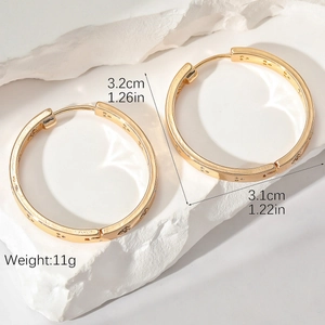 Chic 1.26in gold hoop earrings with star texture and dimensions 3.2cm on stone base