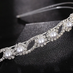 Elegant silver bridal headband featuring double layered pearls and sparkling rhinestones