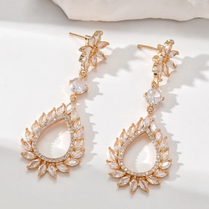 Elegant gold drop earrings with sparkling zircon teardrop pendants and floral accents