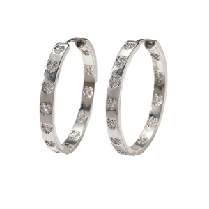 Silver hoop earrings with sparkling diamond heart charms for a minimalist fashion look