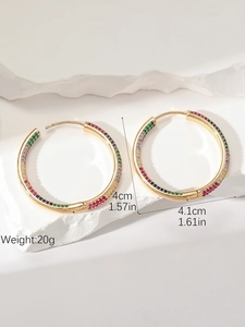 Detail view of large gold hoop earrings with multi-color zircon stones and size measurements