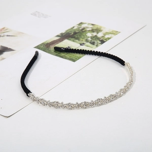 Elegant thin silver alloy headband with sparkling wavy rhinestones and black ends