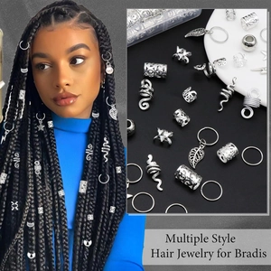 Detail of silver alloy braid jewelry set featuring snake and leaf charms for hair
