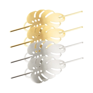 Set of four metal monstera leaf hair sticks in brushed gold and silver finishes