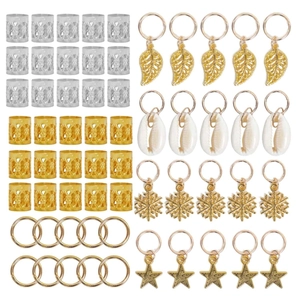 Macro shot of gold and silver hair charms including leaf shell and snowflake pendants