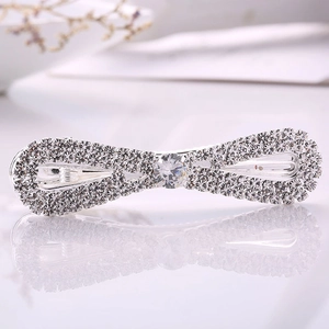 Elegante fermaglio per capelli a fiocco argento con strass e cristallo centrale
