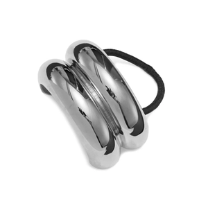 Detail view of a silver-finished metal hair tie with a double-row arc design and black cord