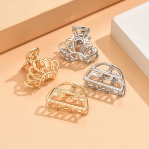 Set of 4 gold and silver metal hair claw clips with crown and geometric half-circle designs