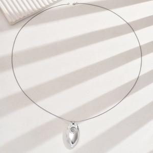 Minimalist silver-tone water drop pendant necklace with sleek polished finish and long chain