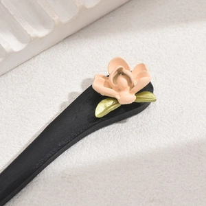 Vintage ebony wood hair stick featuring pink flower and green leaves in elegant style