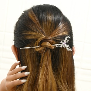 Elegant silver twig hairpin with a purple gemstone in a Chinese style updo hairstyle