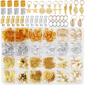Detail of 200pcs gold and silver metal hair braid rings with stars and charms in a storage box