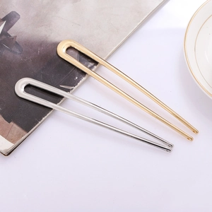 Elegant U-shaped metal hair forks in gold and silver finish with minimalist pearl accents