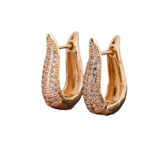 Elegant gold U-shaped hoop earrings with micro-pave cubic zirconia on white background