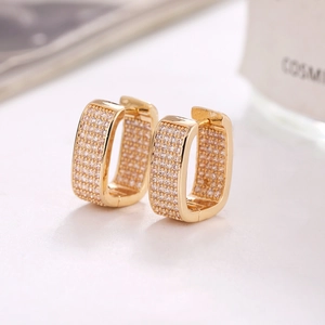Luxury gold rectangle huggie earrings featuring micro-paved white zircon stones