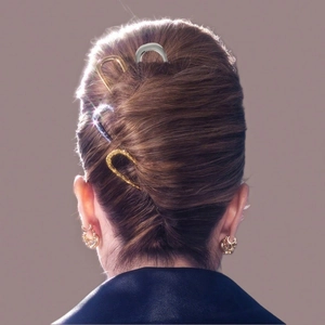 U-shaped hair pin set with gold, silver and marble textures in a French hair bun style