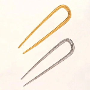 U-shaped metal hairpins in gold and silver with modern minimalist hammered texture
